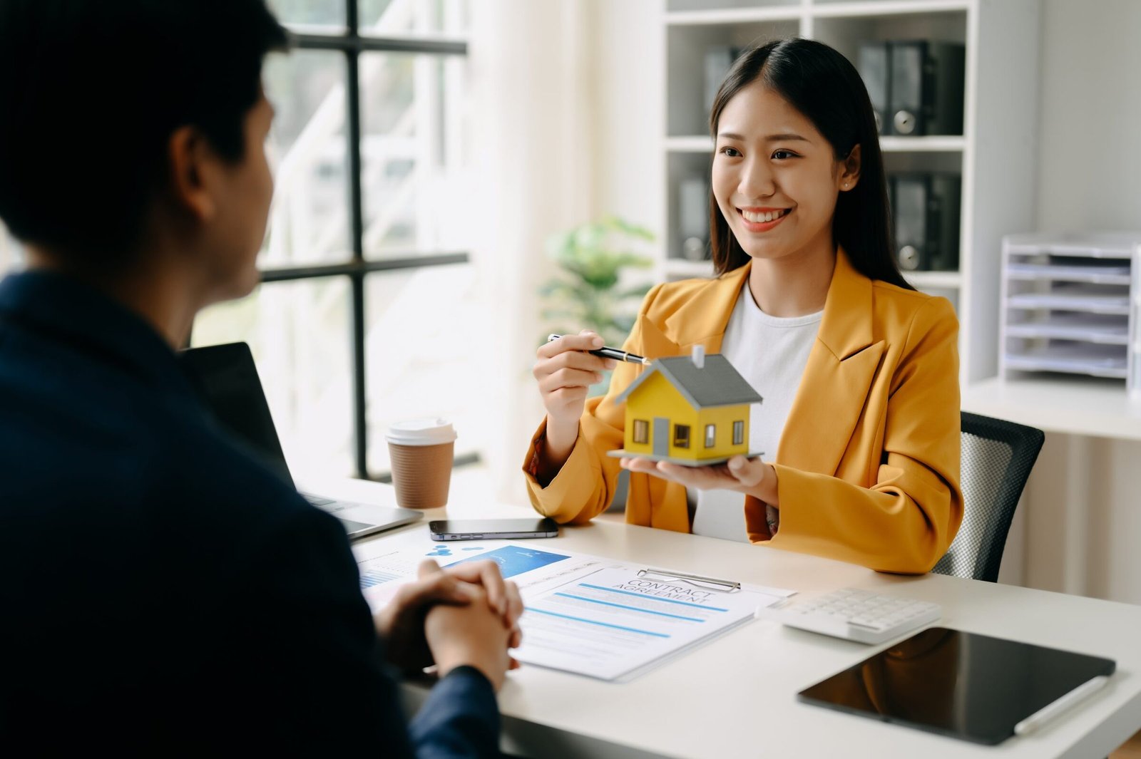 A real estate investor reviews rental income projections while comparing DSCR Loan financing options for an investment property.