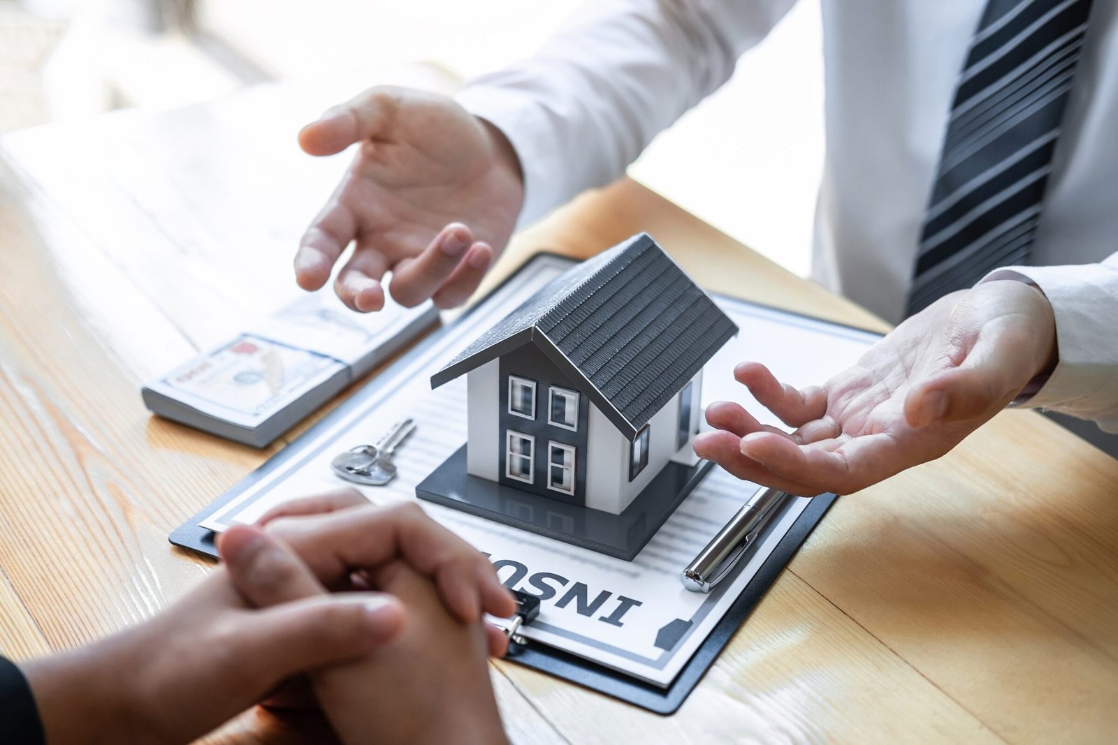A first-time homebuyer in New York meets with a mortgage advisor to review down payment options and financing programs.